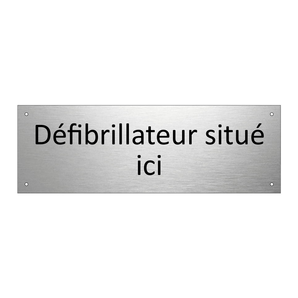 Défibrillateur situé ici