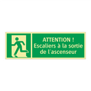 ATTENTION ! Escaliers à la sortie de l'ascenseur