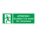 ATTENTION ! Escaliers à la sortie de l'ascenseur