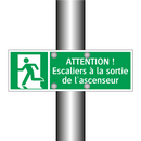 ATTENTION ! Escaliers à la sortie de l'ascenseur