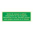 Sortie de secours à utiliser uniquement en cas d'urgence. Démolissez ce mur. Veuillez assurer votre propre sécurité en le faisant.