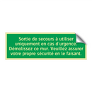 Sortie de secours à utiliser uniquement en cas d'urgence. Démolissez ce mur. Veuillez assurer votre propre sécurité en le faisant.