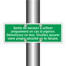 Sortie de secours à utiliser uniquement en cas d'urgence. Démolissez ce mur. Veuillez assurer votre propre sécurité en le faisant.