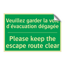 Veuillez garder la voie d'évacuation /.../ - Please keep the escape route clear /.../