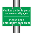 Veuillez garder la porte de secours /.../ - Please keep emergency door clear /.../