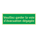 Veuillez garder la voie d'évacuation dégagée
