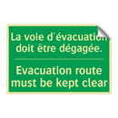 La voie d'évacuation doit être /.../ - Evacuation route must be kept /.../