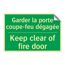 Garder la porte coupe-feu dégagée /.../ - Keep clear of fire door