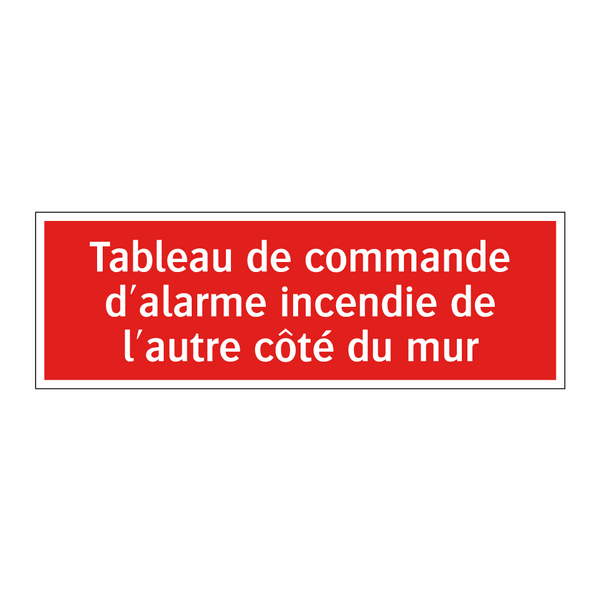Tableau de commande d'alarme incendie de l'autre côté du mur