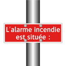 L'alarme incendie est située :