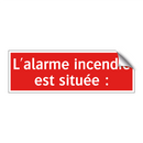 L'alarme incendie est située :