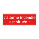 L'alarme incendie est située :