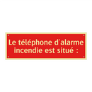 Le téléphone d'alarme incendie est situé :