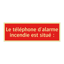 Le téléphone d'alarme incendie est situé :