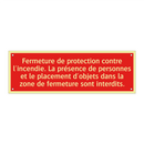 Fermeture de protection contre l'incendie. La présence de personnes et le placement d'objets dans la zone de fermeture sont interdits.