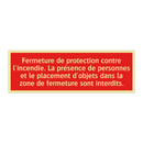 Fermeture de protection contre l'incendie. La présence de personnes et le placement d'objets dans la zone de fermeture sont interdits.