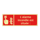L'alarme incendie est située :