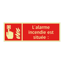 L'alarme incendie est située :