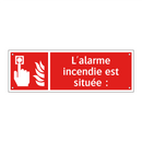 L'alarme incendie est située :