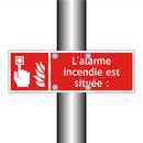 L'alarme incendie est située :