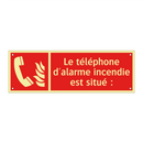 Le téléphone d'alarme incendie est situé :