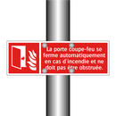 La porte coupe-feu se ferme automatiquement en cas d'incendie et ne doit pas être obstruée.