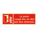 La porte coupe-feu ne doit pas être obstruée.