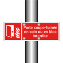 Porte coupe-fumée en coin ou en bloc interdite