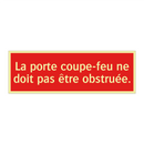 La porte coupe-feu ne doit pas être obstruée.