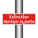 Extincteur derrière la porte