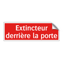 Extincteur derrière la porte