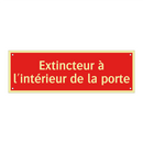 Extincteur à l'intérieur de la porte