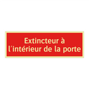 Extincteur à l'intérieur de la porte