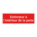 Extincteur à l'intérieur de la porte