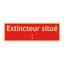 Extincteur situé :