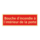 Bouche d'incendie à l'intérieur de la porte