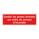 Garder les portes fermées sur ordre du service d'incendie