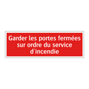 Garder les portes fermées sur ordre du service d'incendie