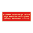 Trappe de désenfumage dans la cage d'escalier activée par le panneau de contrôle incendie