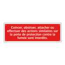 Coincer, obstruer, attacher ou effectuer des actions similaires sur la porte de protection contre la fumée sont interdits.