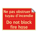 Ne pas obstruer le tuyau d'incendie /.../ - Do not block fire hose