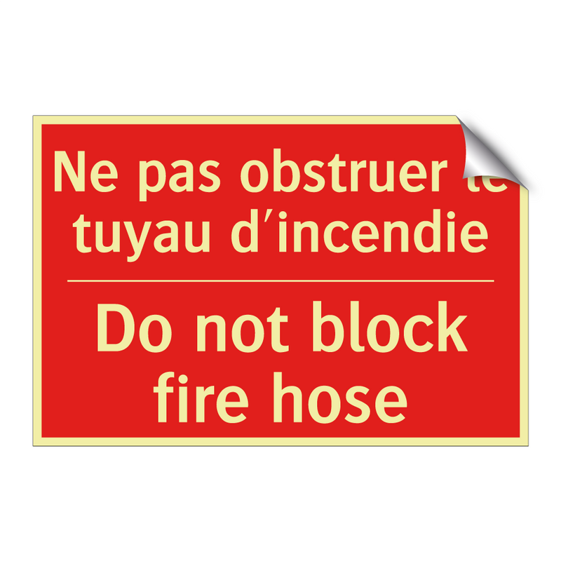 Ne pas obstruer le tuyau d'incendie /.../ - Do not block fire hose