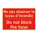 Ne pas obstruer le tuyau d'incendie /.../ - Do not block fire hose