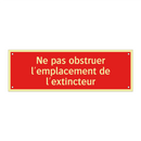 Ne pas obstruer l'emplacement de l'extincteur