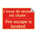 L'issue de secours est située /.../ - Fire escape is located: