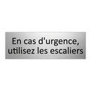 En cas d'urgence, utilisez les escaliers