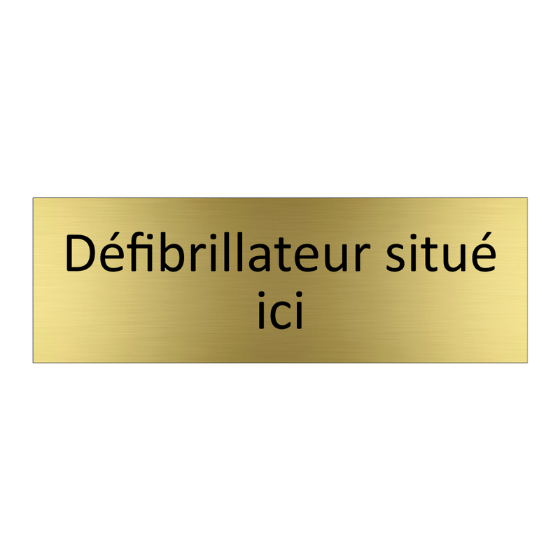 Défibrillateur situé ici