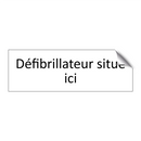 Défibrillateur situé ici