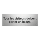Tous les visiteurs doivent porter un badge.