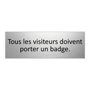 Tous les visiteurs doivent porter un badge.